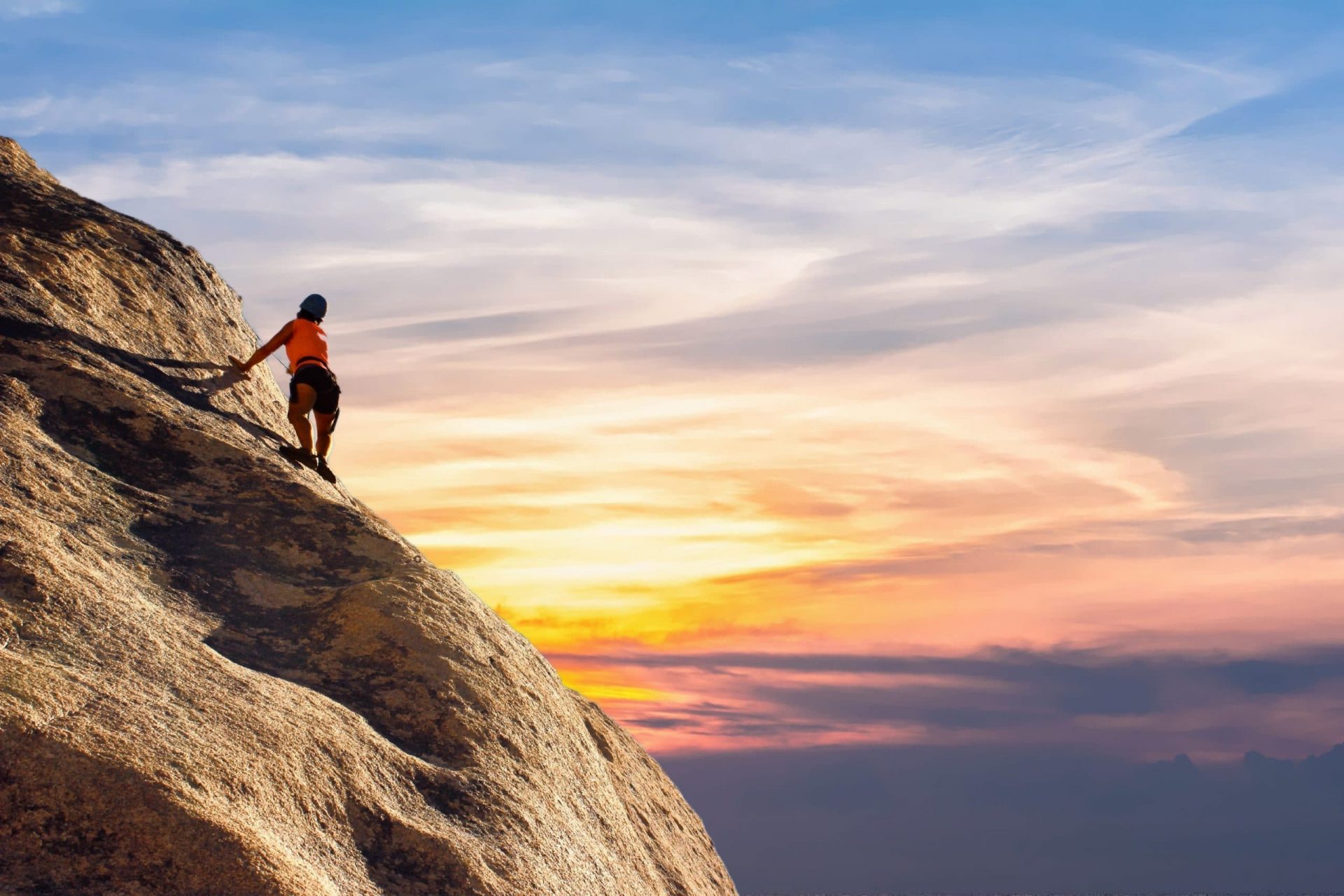 woman climbing a mountain, learning is an experience